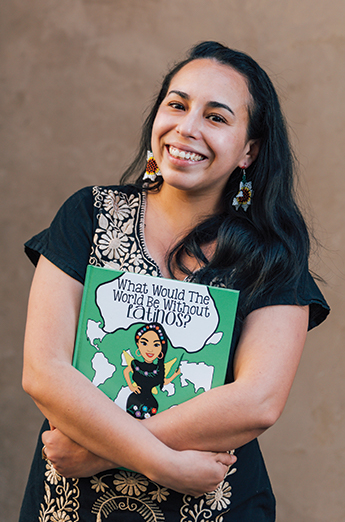 Araceli Leon holding her book and smiling