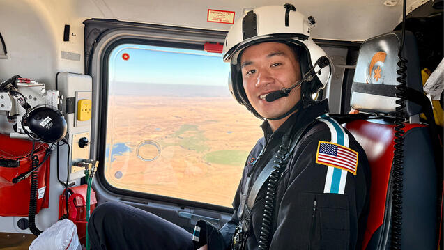 Paul Uong in a helicopter