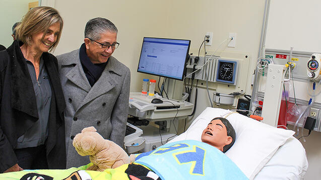 Sheri Sobrato and President Aceves with a SimJunior