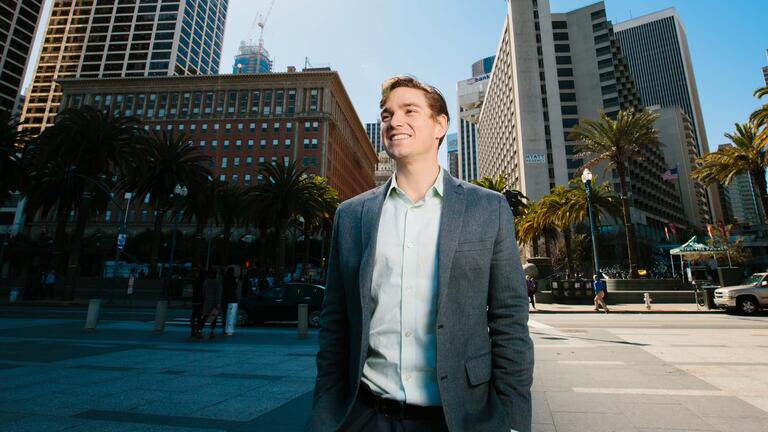 Student looks at the buildings in San Francisco's Financial District.