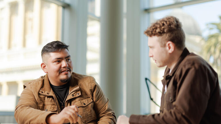 two students talking to eachother
