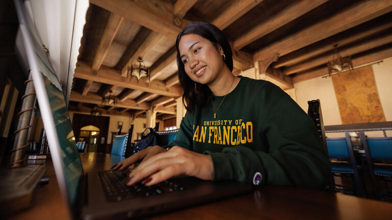 Student working on computer.