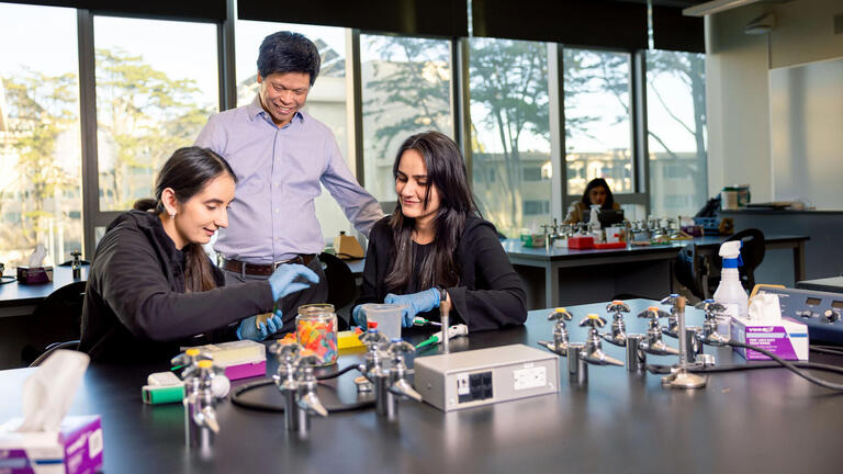 students doing a biology experiment in a lab