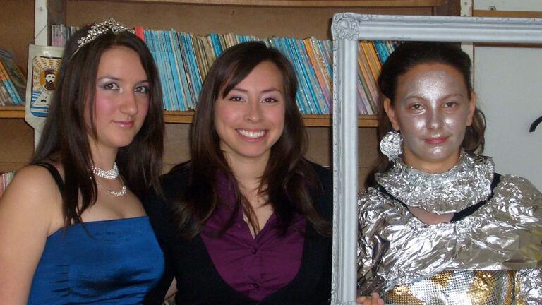 Valarie with two women in costume at a party while in the peacecorps