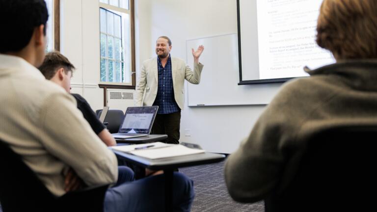 professor Hughes presenting to students
