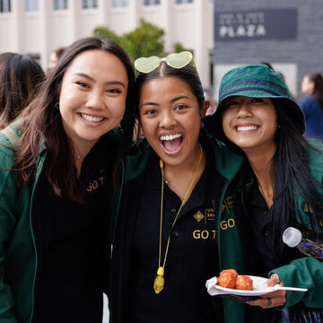 Three members of the Go! team gather for a photo