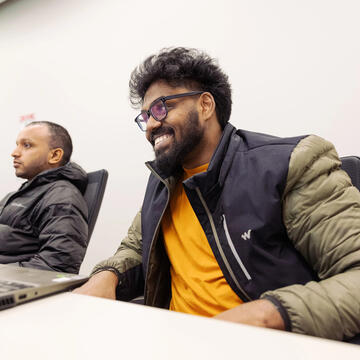 USF student smiling in class