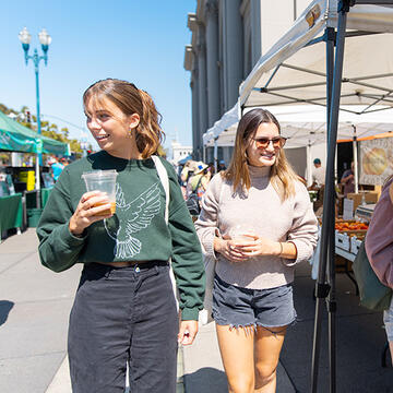 students walk together at ferry market