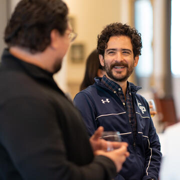 two people talking to each other during an event