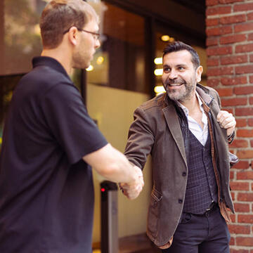 Two people shaking hands.