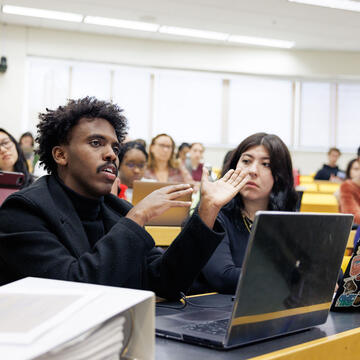 Student in lecture hall speaking