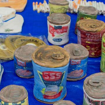 art piece of different canned foods made by hand