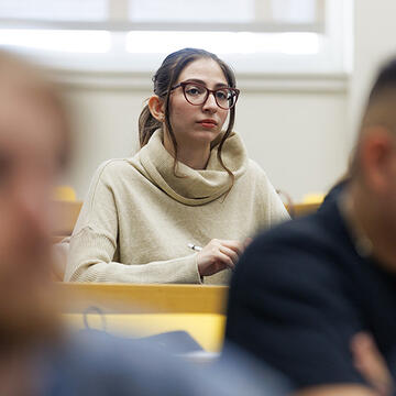 student sits in class