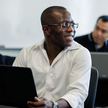 Student in class smiling
