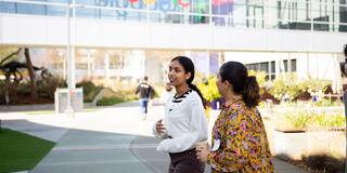 Two USF students walking outside the Google office