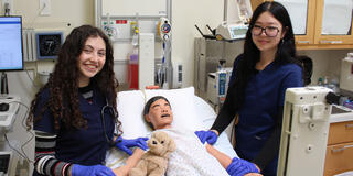 USF SONHP students with pediatric manikin