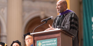 Retired California Supreme Court Justice Martin Jenkins speaking at 2026 commencement